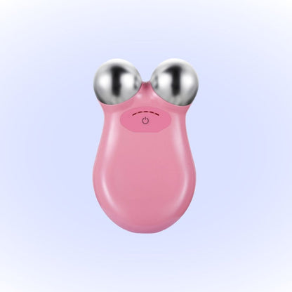 Pink version of the microcurrent facial device with dual spherical probes, designed for skin lifting and toning, suitable for home beauty treatments.