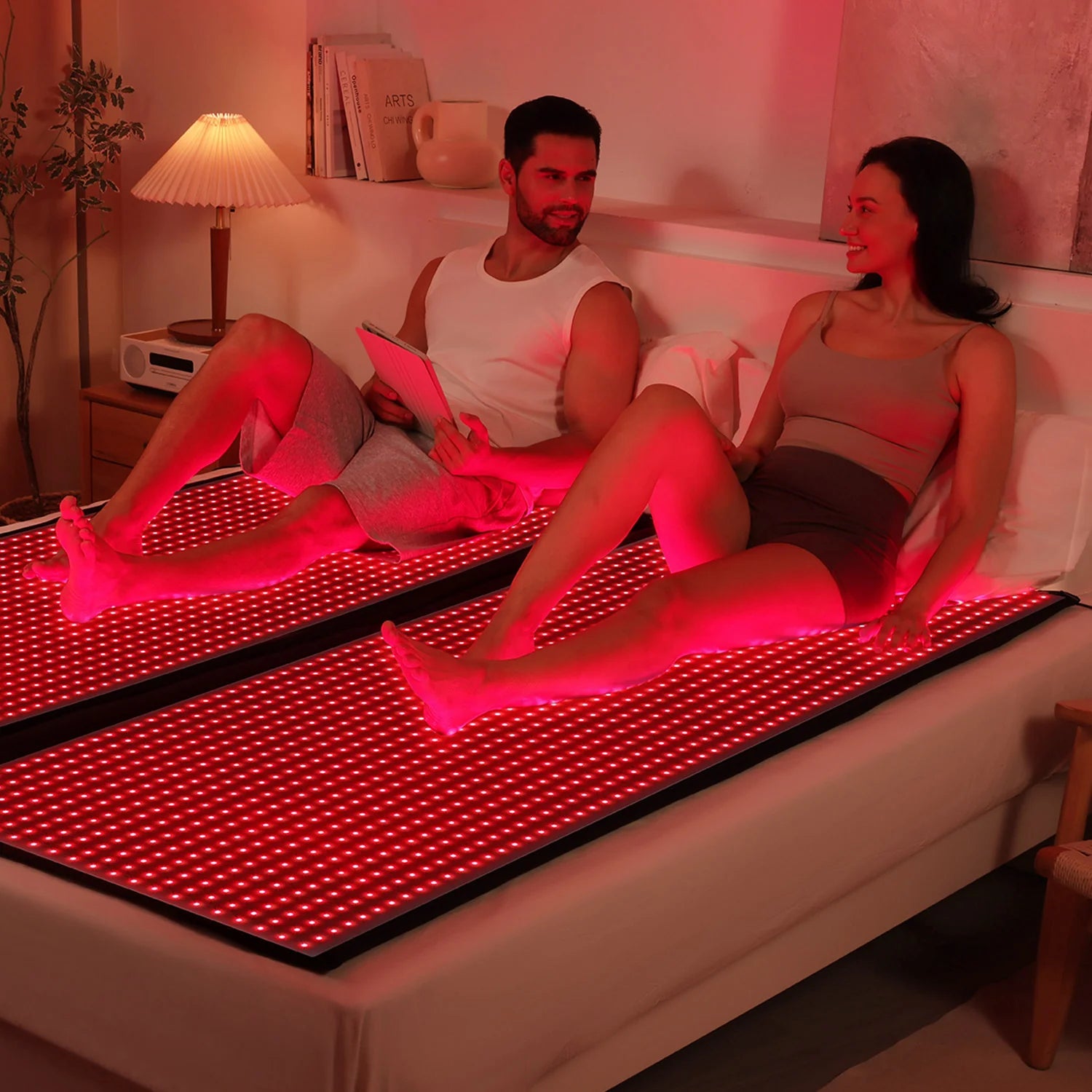 Person undergoing a full-body red light therapy session using the mat, emphasizing the mat’s effectiveness in muscle relaxation and improved blood circulation.